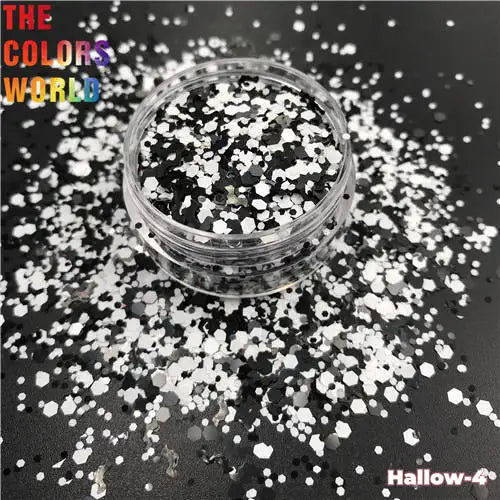 Jar of black and white glitter with 'The Colors World' text on a black background