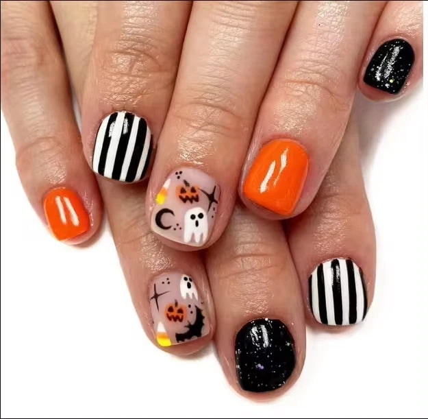 Halloween-themed nail art on a white background