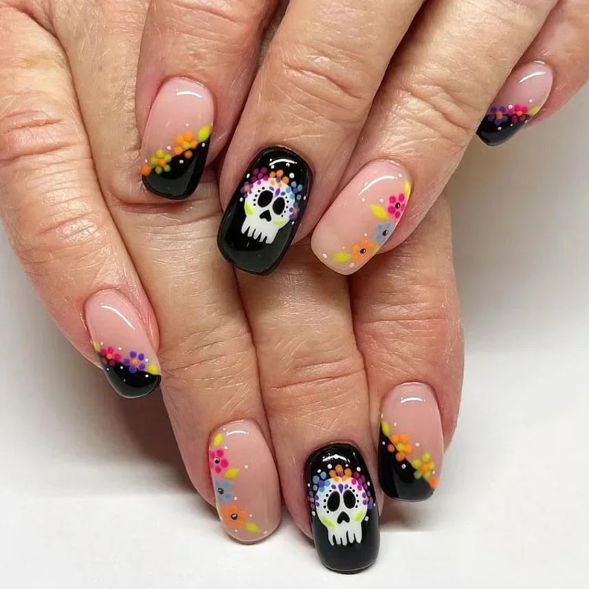 Nails with colorful skull design on a white background