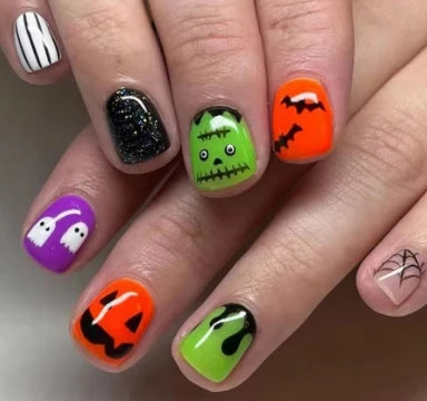 Hand with Halloween-themed nail art on a neutral background