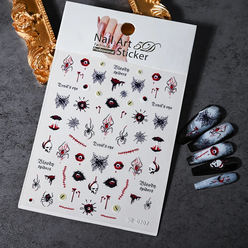Nail art sticker sheet with Halloween-themed designs on a dark surface.