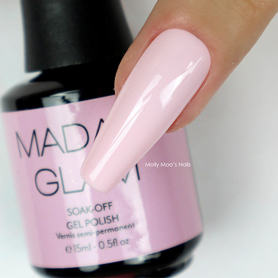 MAD GLAM soak-off gel polish bottle with a hand showing a pink nail.