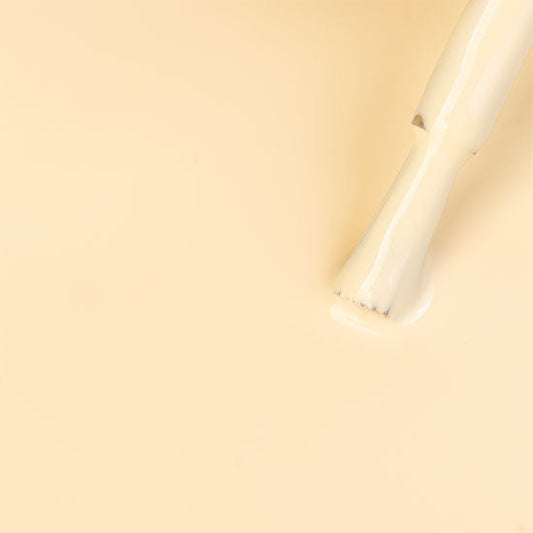 White cylindrical object on a beige background