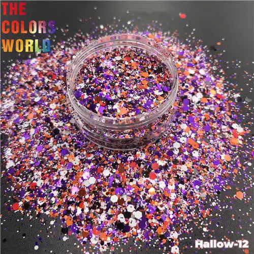 Colorful glitter in a small container with 'The Colors World' text on a dark background.