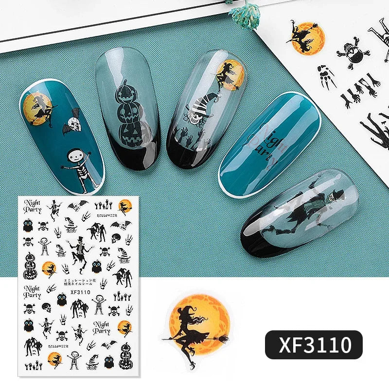 Nail art designs with Halloween theme on teal background, featuring a sheet of temporary tattoos.