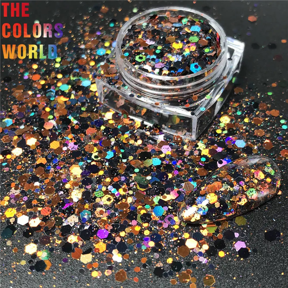 Multicolored glitter in a clear container on a black background with 'The Colors World' text.