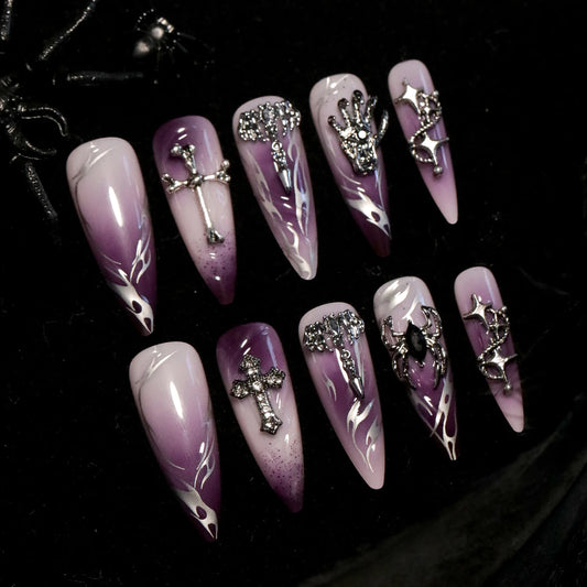 Set of purple and white gradient halloween press on nails with decorative elements on a dark background