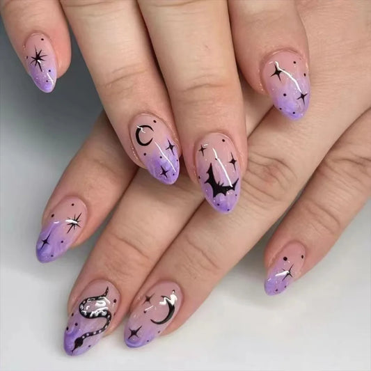 Nails with purple and pink gradient design featuring stars and moons on a neutral background