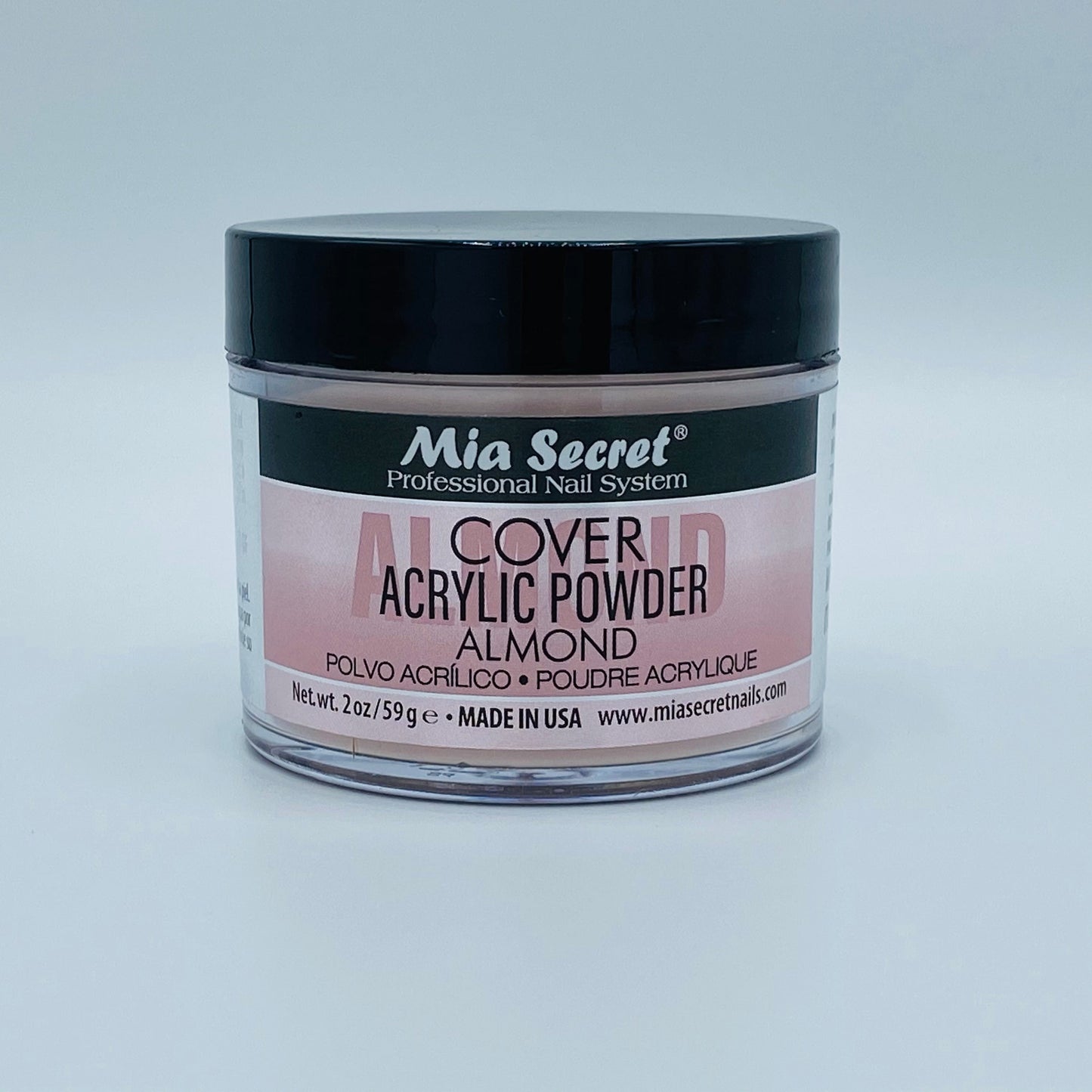 Jar of Mia Secret acrylic powder on a light gray background