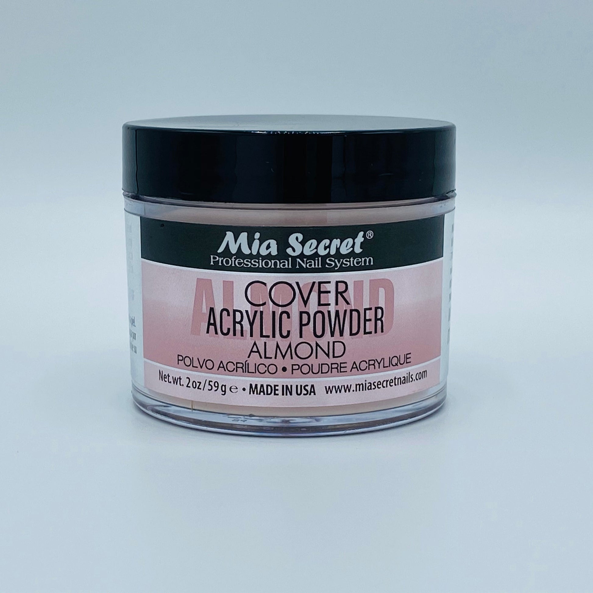 Jar of Mia Secret acrylic powder on a light gray background